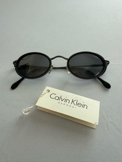 Calvin Klein Women's Oval Lightweight Black Sunglasses
