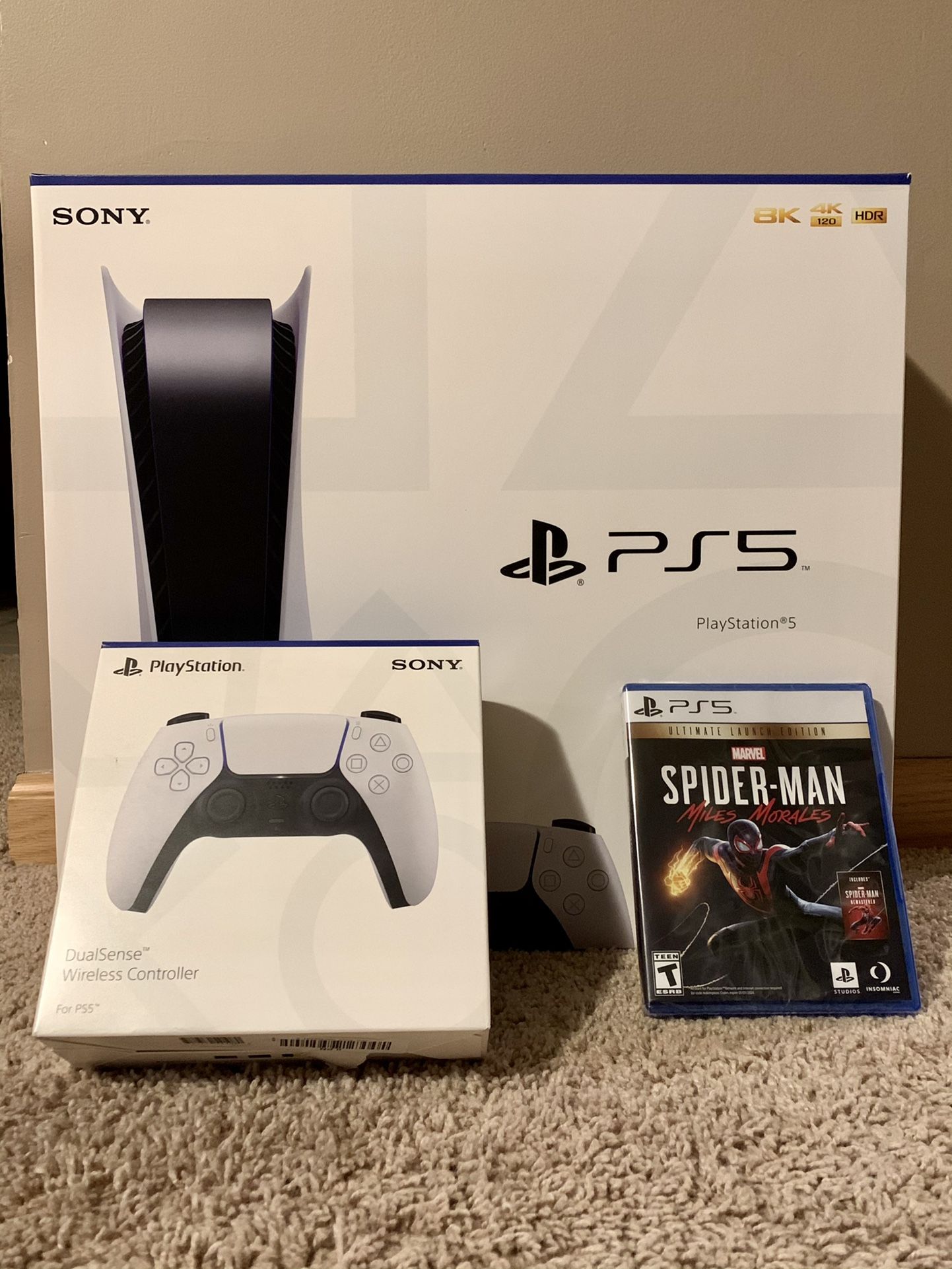 PS 5 with, extra controller, and Spider-Man “Miles Morales” video game.
