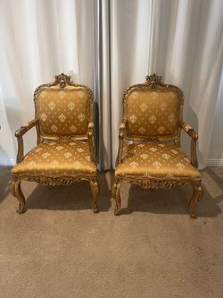 A Pair Of Vintage Hand Carved And Gold Leafed Chairs
