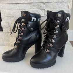 Chic black lace-up boots with high heels. Stylish and bold design. Perfect for elevating any outfit.  Only worn once, in almost new condition as you c