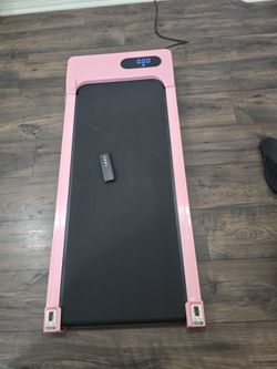 Under desk pink treadmill