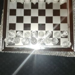 THIS ABSOLUTELY STUNNING POLISHED GLASS CHESS SET. 