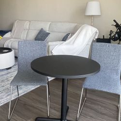 Ikea Black Round Table and 2 Dark Grey chairs