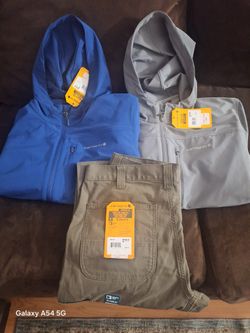 Carhartt Pants, And 2 Carhartt Storm Defender Packable Jackets. 