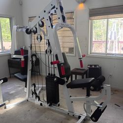 Body Solid universal multi station 210 stack butterfly, press, low row, leg extention and mid pulley