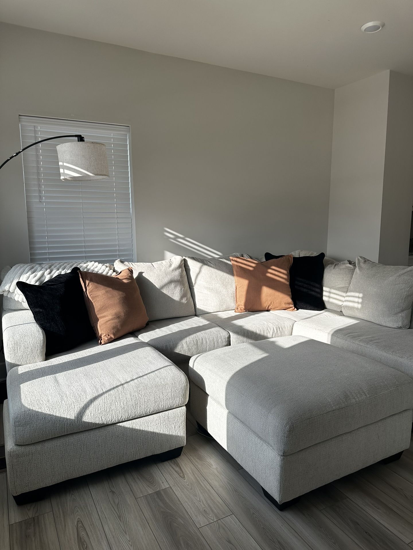 Cream Colored 2 Piece Sectional With Chaise And Ottoman