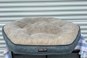 37” Washable Kirkland Signature Round Pillowtop Orthopedic Dog Bed, featuring a tufted, neutral-colored cushion.
