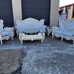 Sofa, loveseat, chair, and tables