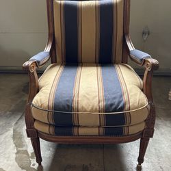 Wooden upholstered Arm chair (40” tall x 24” d x 28.5” w) 