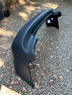 Rear bumper cover for a 2005 Honda Accord