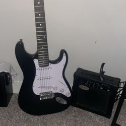 Electric Guitar with amp, pic, and capo