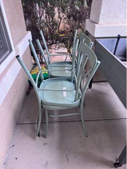 Sage green metal chairs