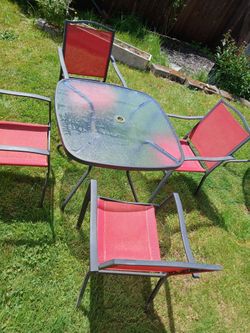 Glass outdoor table with chairs