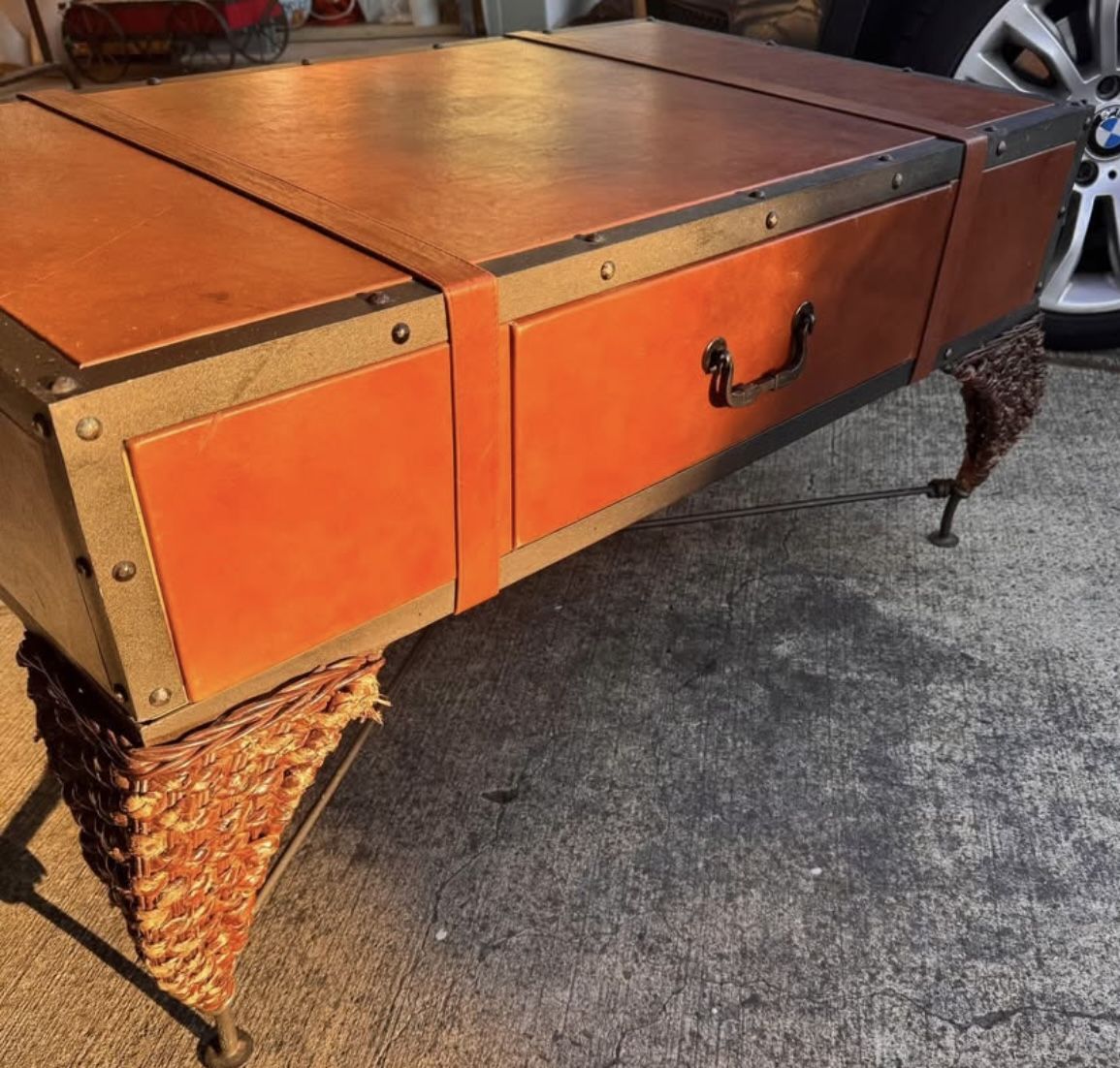 One of a kind trunk leather cast iron coffee table.