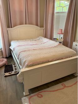 Queen size white (frame only). Box and mattress NOT included.