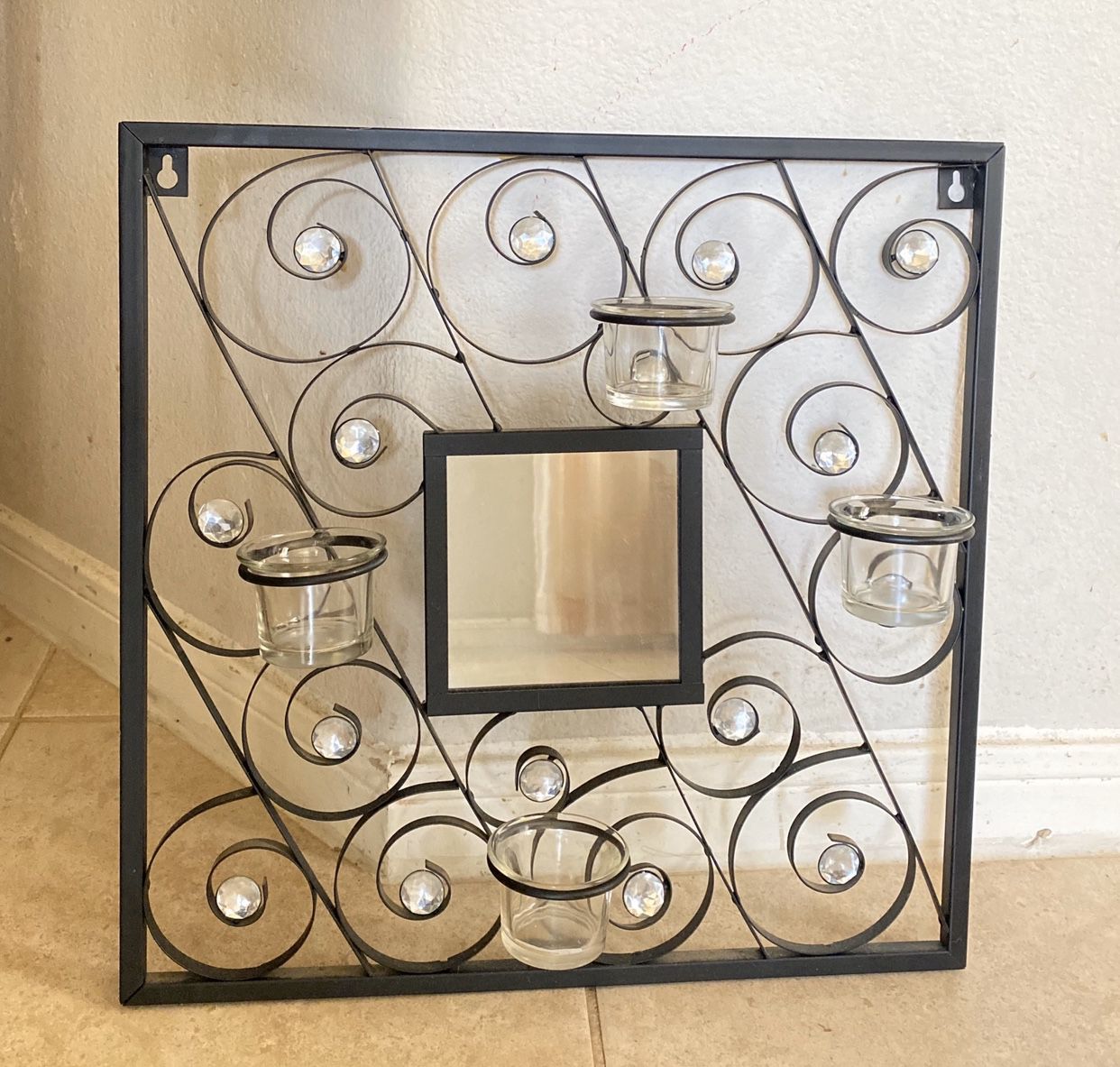 Wall frame with candle holders