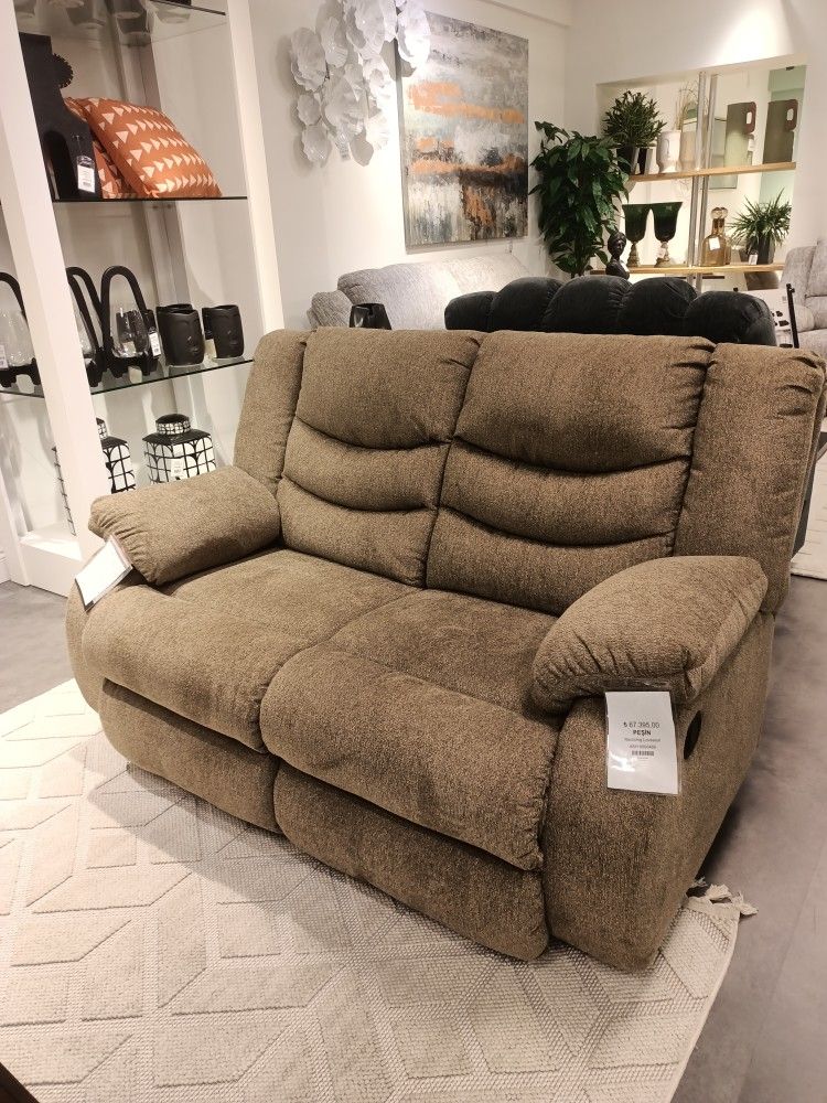 Tulen Gray Reclining Loveseat

Ashley Furniture $10 Down Payment And Financing Available
