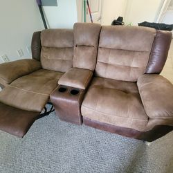 Reclinable sofas with charging station