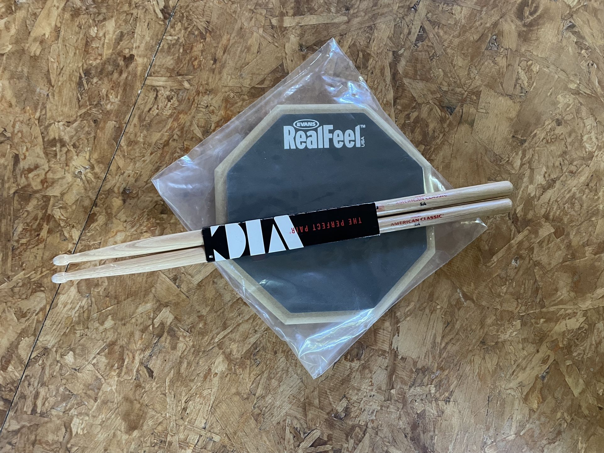 Drum practice pad and sticks