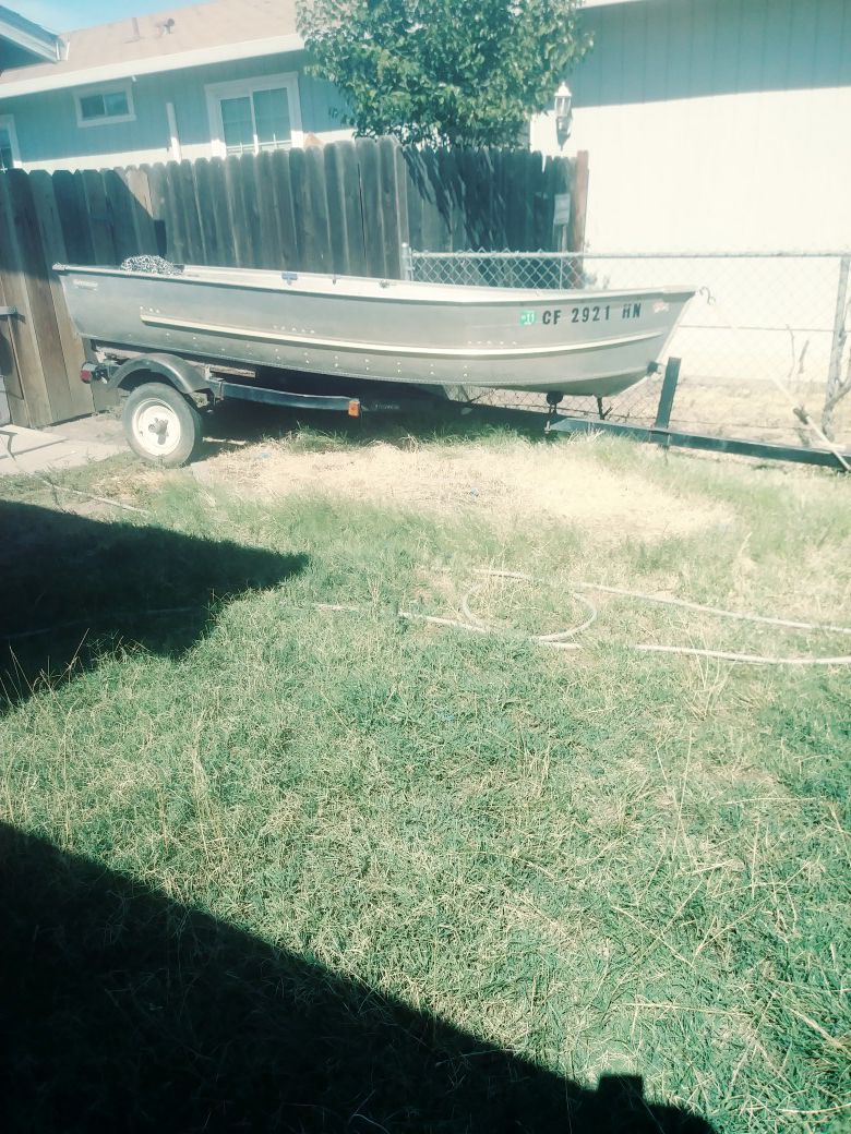 12 ft aluminum boat w/ trailer and motor