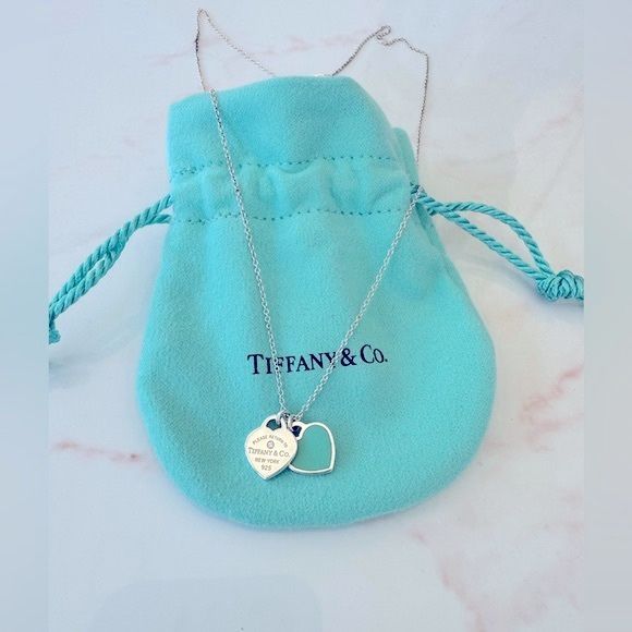 Tiffany &Co. double mini heart pendant with a diamond