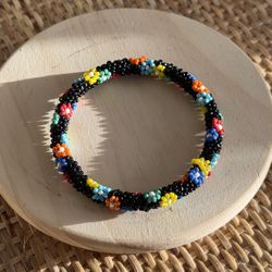 Handwoven Multicolor Beaded Bracelet – Black Base Floral Pattern Stretch Bangle