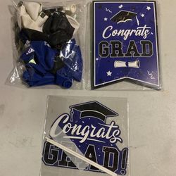 New graduation banner, tabletop decoration and 18 blue white and black balloons that say Happy Graduation, You did it and Congrats Grad 
