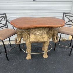 Resin elephant with marble top table and chairs set.