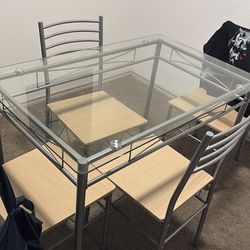 Small glass table with 4 chairs