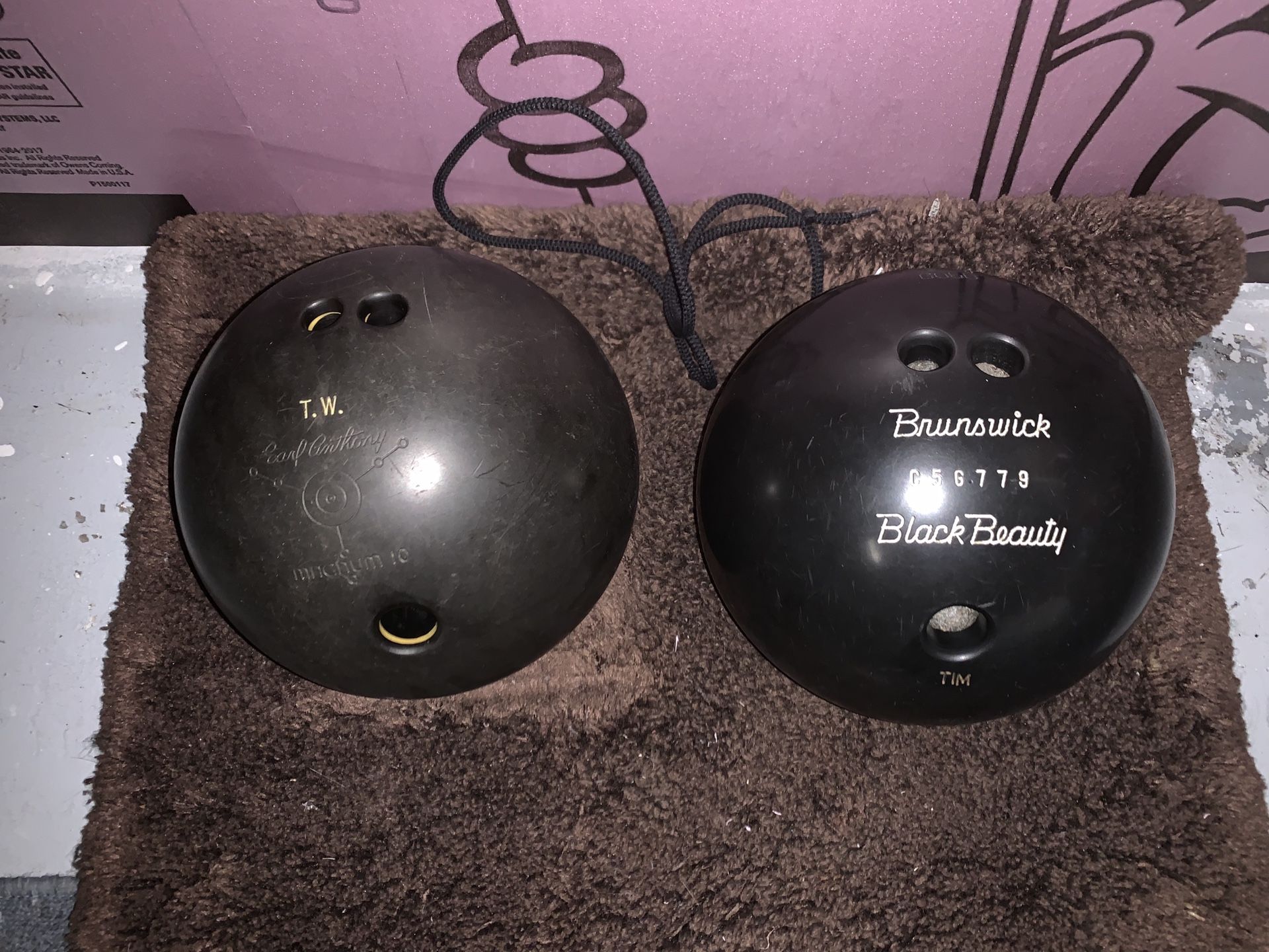 Brunswick black beauty 14.2 pound ball and Earl Anthony Magnum 10 15.2 pound ball