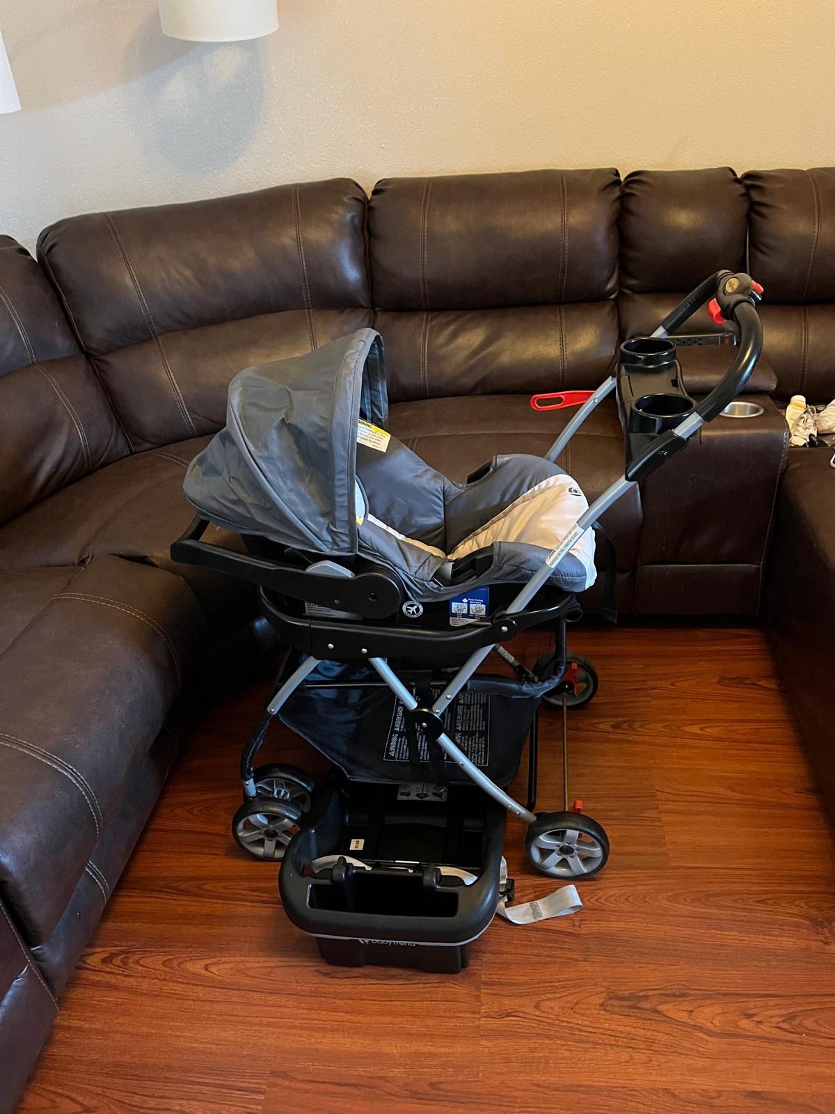 BABY TREND SNAP-N- GO STROLLER AND NEW BORN CAR SEAT