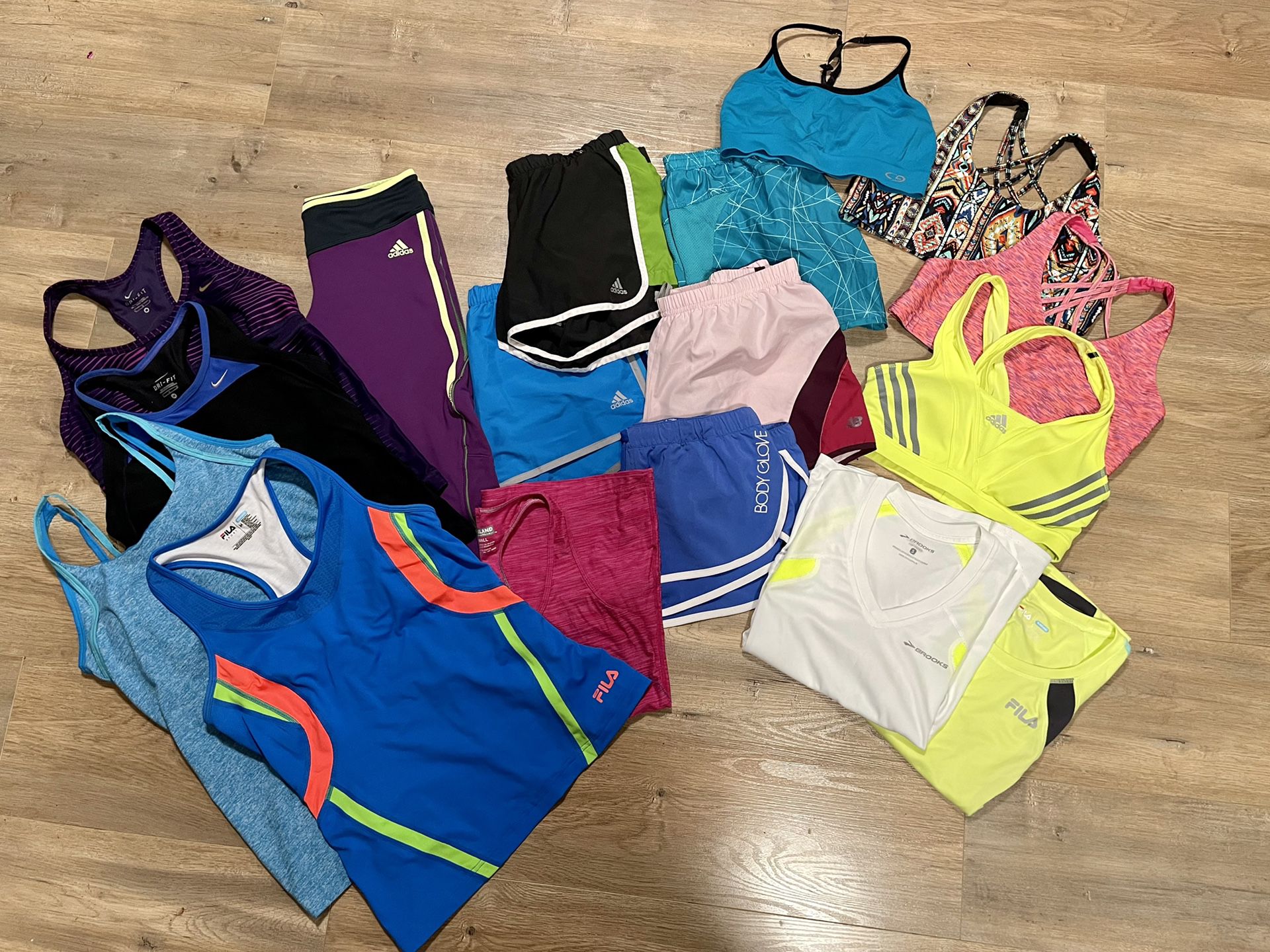 Women’s workout clothes size Medium, Adidas, Nike, Brooks, 17 pieces, shorts, tanks, capris