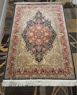 81 by 51 1/2” Chinese Silk Rug