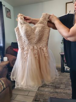 Sleeveless short dress size medium with a open back design