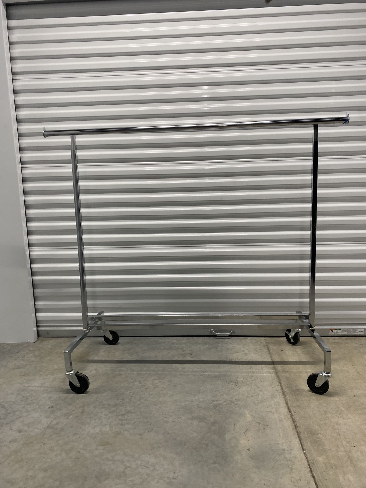 Rolling Metal Clothing rack Adjustable Pre owned