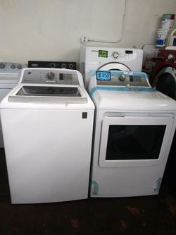 NEW scratch and dent GE top load washer and dryer set