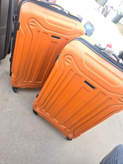 Large Orange hard case luggages