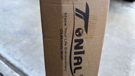 1” brown curtain rod.
