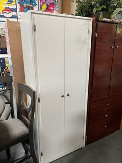 White compressed wood tall closet