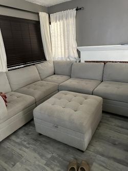 Light Gray Tufted Sectional Sofa with Ottoman