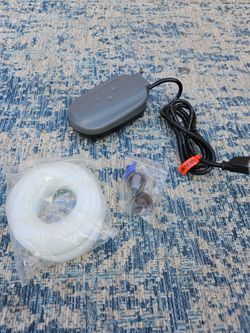 Anjon LifeLine Air Pump Kit, specifically a model like the LL-4 or LL-12, designed for aeration in small ponds and water gardens.The kit includes the 