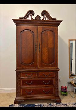 Traditional Wood Armoire with Carved Details
