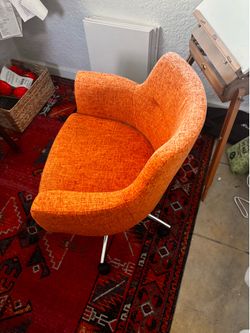 Small orange desk swivel chair