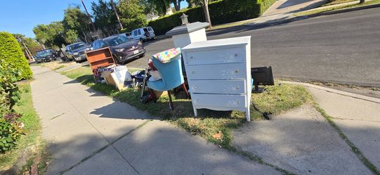 Curb alert . One day yard sale  left overs.
