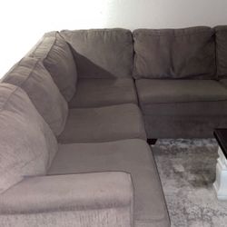 grey L shaped couch