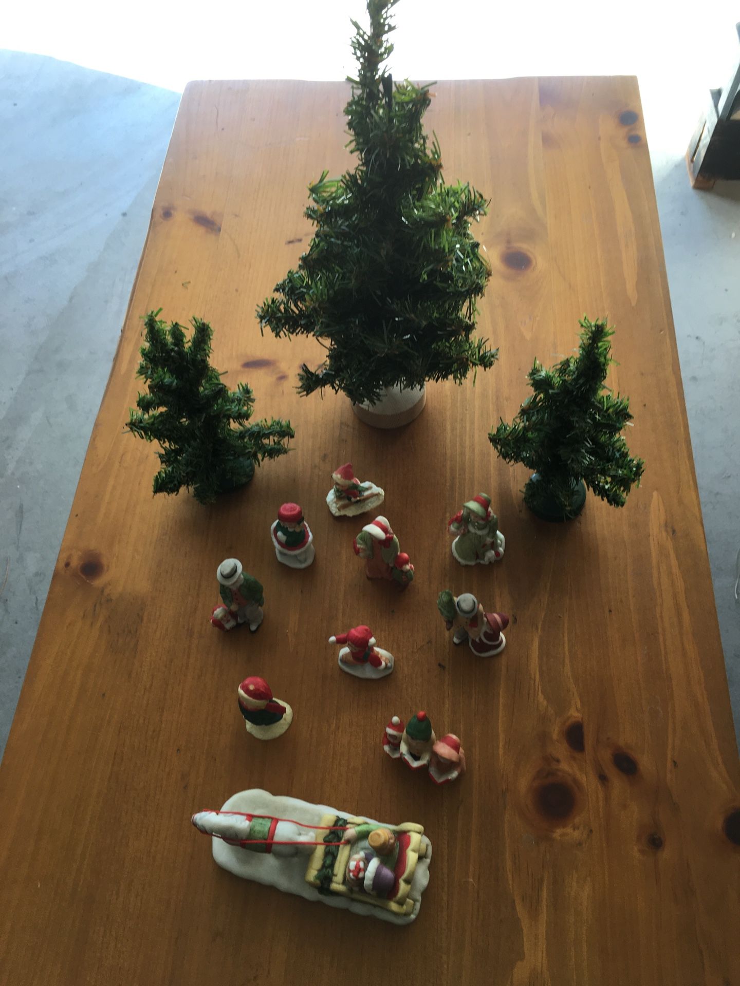 Christmas Village Figurines and Pine Trees