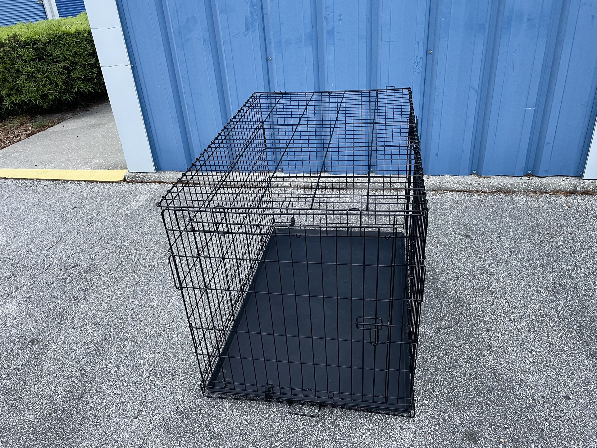 Dog Kennel -( size: 28”x 32”x 30” in high, comes with side door )- Used