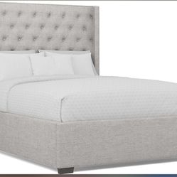 Light gray bed, frame and mattress.