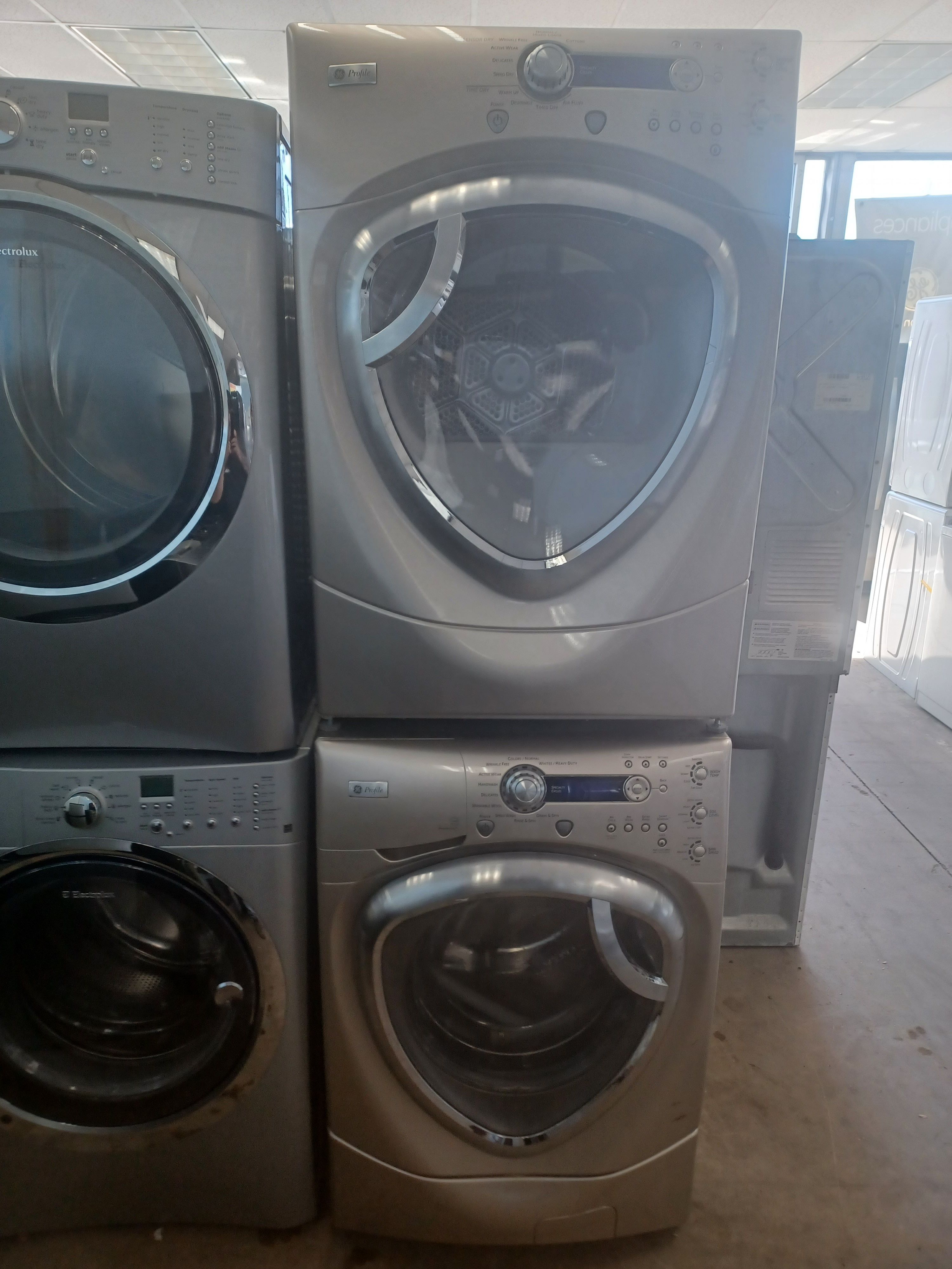 GE PROFILE GOLD TRIANGLE DOOR FRONT LOAD WASHER AND ELECTRIC DRYER SET