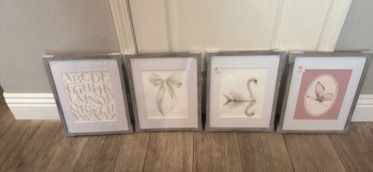 Four piece wall art in grey wood frames